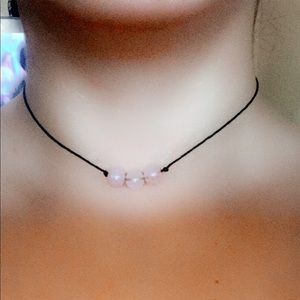 Handmade necklace with light pink crystals.